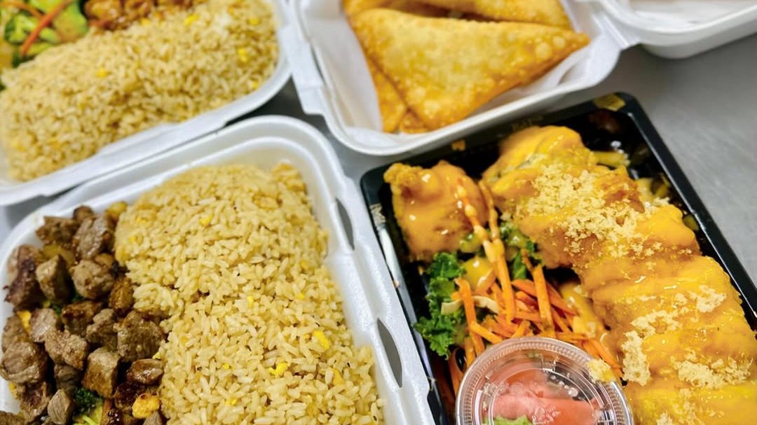 Bamboo Hibachi takeout plates of hibachi steak and chicken teriyaki with egg fried rice, crab rangoon and an Arkansas deep fried sushi roll